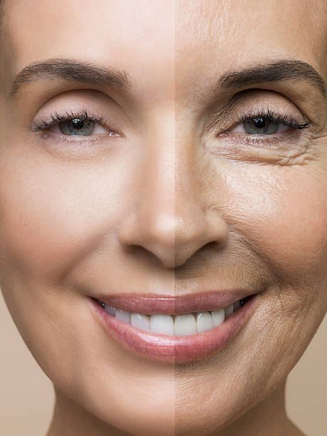 studio-shot-of-smiling-middle-aged-woman-with-younger-skin